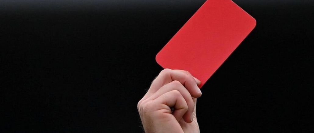 GAA match official brandishing a red card